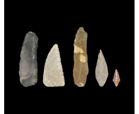 Neolithic period, 5th-3rd millennium BC. A mixed group of flint implements comprising: a multi-edged long scraper retouched t