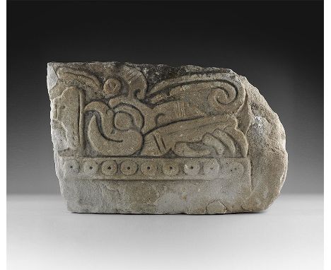 Toltec-Maya, Post Classic Period, 900-1200 AD. A sandstone frieze panel with head of a parrot or macaw, with large eye and cu