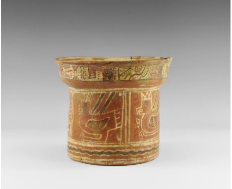 1st millennium AD. A drum-shaped ceramic with flared base, panels of zoomorphic design to the body geometric frieze to the ba