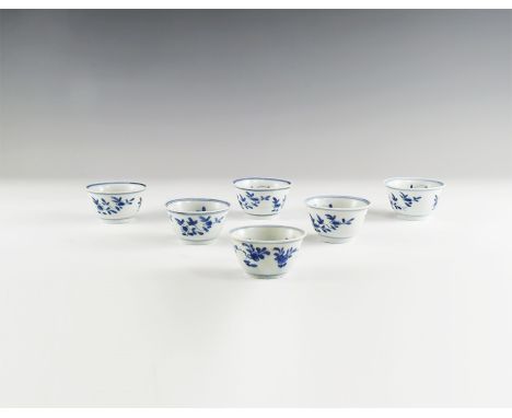 Kangxi Period, Late 17th century AD. A group of six blue and white glazed ceramic tea bowls with blossom decoration. From the