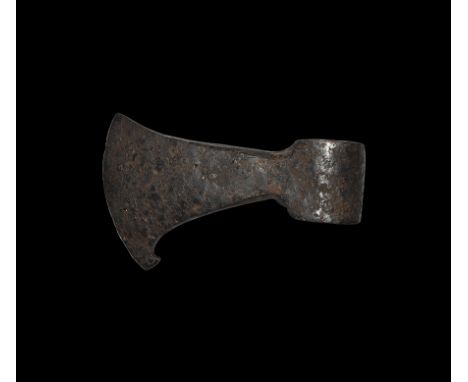 9th-11th century AD. A hand-forged iron axehead with triangular-section blade widening to a broad bevelled edge with square c