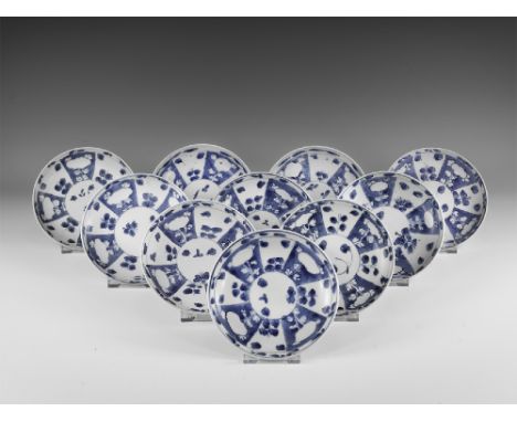 Kangxi Period, Late 17th century AD. A group of ten blue and white glazed ceramic saucers with floral decoration. From the 'B