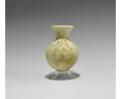 1st millennium BC. A spherical ceramic jar with funicular neck and rounded rim; cream pigment to the shoulder with alternatin