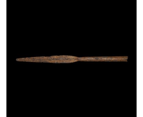 2nd century BC-1st century AD. A hand-forged iron spearhead with slender, round-tipped, leaf-shaped blade, narrow neck, tubul