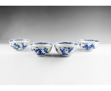 Kangxi Period, Late 17th century AD. A group of four blue and white glazed ceramic fluted bowls with blossom decoration. From