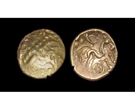 55-45 BC. Obv: abstract wreath pattern with hidden face. Rev: triple-tailed horse right, charioteer's arms and pellets above,