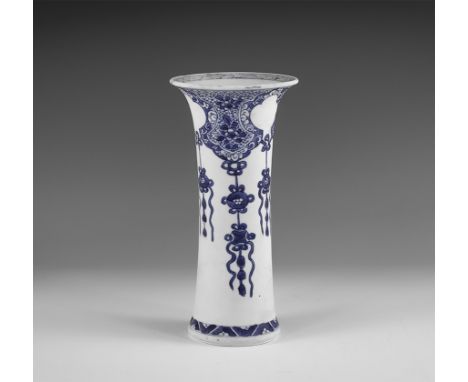 Kangxi Period, Late 17th century AD. A blue and white glazed ceramic beaker vase with hatching to the rim, swags of chrysanth