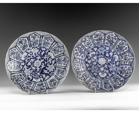 Kangxi Period, Late 17th century AD. A pair of blue and white glazed ceramic lotus dishes with dense chrysanthemum and tendri