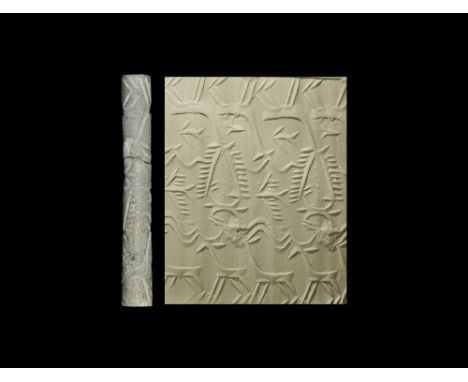 Circa 3000 BC. A long, slender hardstone cylinder seal with intaglio animals; accompanied by a museum-quality impression and 