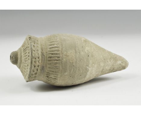 9th-11th century AD. A hollow ceramic biconical vessel decorated with thick conical nozzle; to the shoulders and neck incised