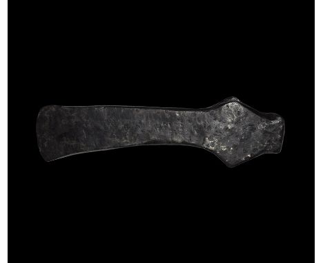 9th-11th century AD. An iron axehead with substantial rectangular-section blade, narrow curved edge, lateral flanges to the s