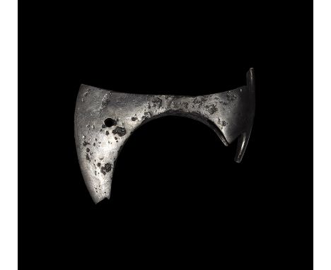 9th-11th century AD. An iron axehead with small triangular-section blade widening to a broad bevelled edge with square chin a