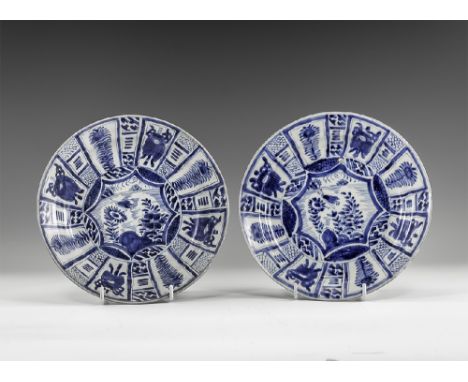 Kangxi Period, Late 17th century AD. A pair of blue and white glazed ceramic dishes with floral and geometric decoration. Fro