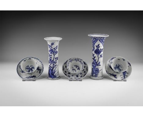 Kangxi Period, Late 17th century AD. A group of blue and white glazed ceramic items comprising: two beaker vases with panels 