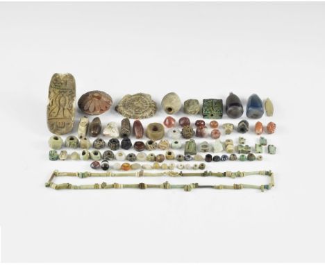 Middle Kingdom, 2133-1797 BC. A large group of stone, glass, ceramic, glazed composition and wood beads and pendants, ancient