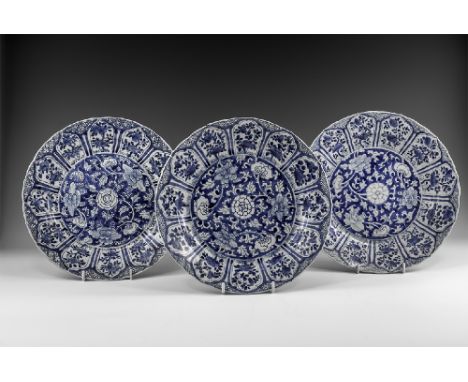 Kangxi Period, Late 17th century AD. A group of three blue and white glazed ceramic lotus dishes with central dense chrysanth