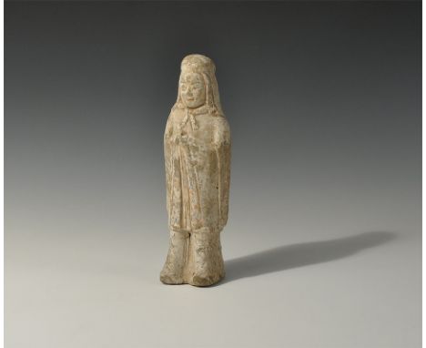 Northern Qi Dynasty, 550-577 AD. A hollow-formed ceramic figure of a standing robed male with hood and open-fronted mantle, b