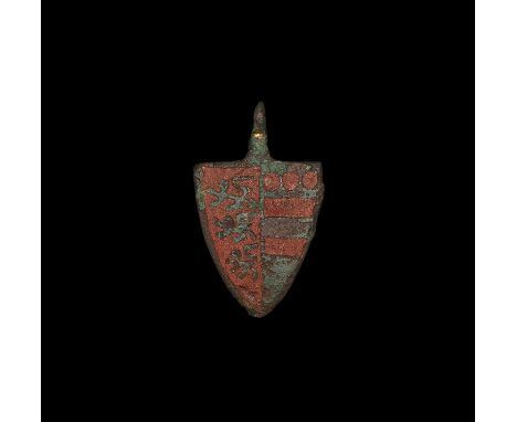 14th century AD. A heavy cast heater-shield pendant with short neck and pierced lug for suspension; the field in red enamel d