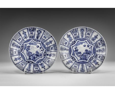 Kangxi Period, Late 17th century AD. A pair of blue and white glazed ceramic dishes with flowers and geometric decoration. Fr