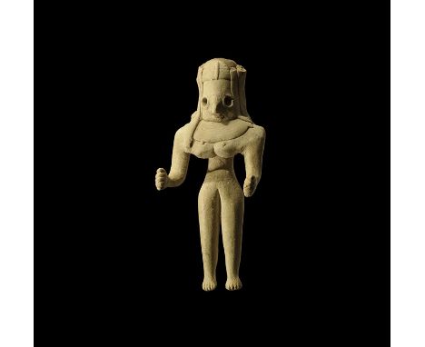 3rd-2nd millennium BC. A ceramic figurine of a female with straight legs and flexed arms, D-shaped head surrounded by hanks o