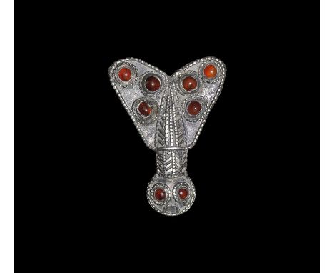 5th century AD. A large hollow-formed silver plate brooch of a stylised cicada with D-shaped head, short neck and triangular 