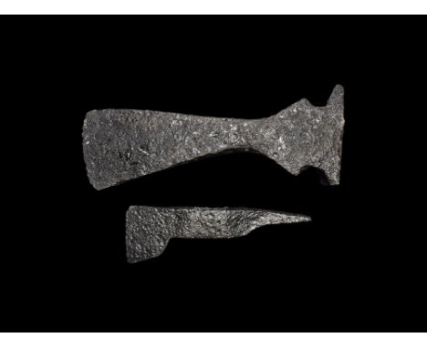 11th-15th century AD. A pair of iron axeheads, the larger with curved edge, flared wings to socket, hammer to the reverse, th
