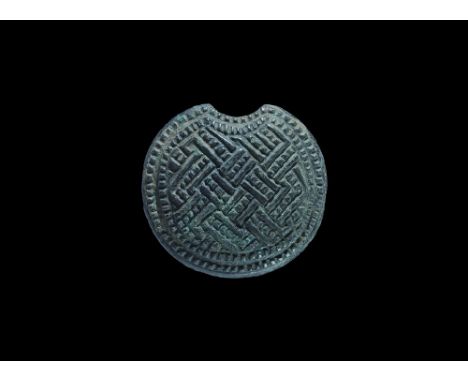 11th-12th century AD. A domed patrix die for 'kolt' temple ring with reserved latticework and beaded border. From an old Muni
