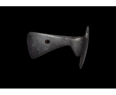 9th-11th century AD. An iron axehead with triangular-section narrow blade widening to a bevelled edge with central hole, sock