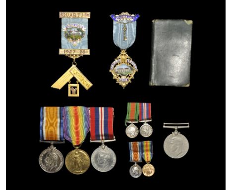 1919 to 1945 AD. Group comprising: World War I pair, 1914-1918 War medal and Victory medal (both named as issued to LIEUT. H.