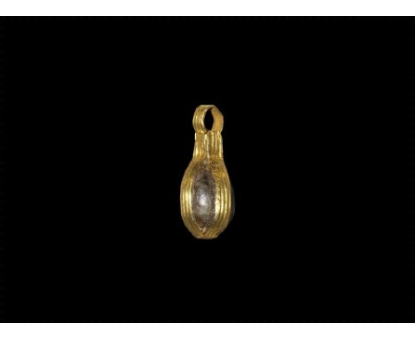 7th century AD. An olive-shaped glass bead enclosed in a cage of four gold ribbed straps with integral loop. Property of a Lo