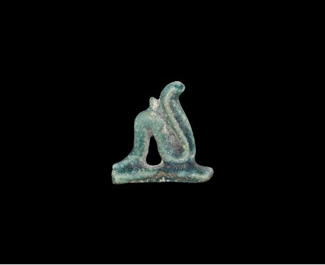 Late Period, 664-332 BC. A blue-glazed ceramic amulet of a bent cobra on a rectangular base. Property of a Essex gentleman; a