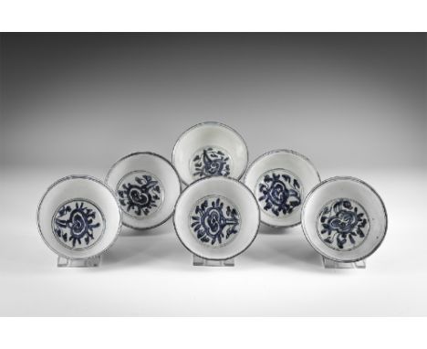 Kangxi Period, Late 17th century AD. A group of six of blue and white glazed ceramic tea bowls with floral decoration. From t