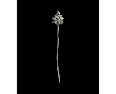 8th-9th century AD. A tapering silver shank and large openwork gold filigree sphere terminal with projecting granule detail. 