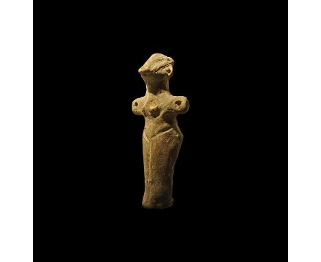Neolithic, 5th millennium BC. A ceramic figure of a female with arms spread, holes at the ends, beaked nose, incised legs and