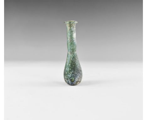 2nd-4th century AD. A dark green iridescent glass flask with bulbous base, tubular neck, returned rim. UK art market, acquire