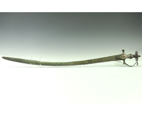 18th-19th century AD. A steel talwar sword with single-edged blade curved for its lower quarter and double-edged; the grip le