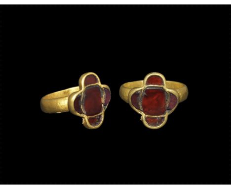 Later 5th century AD. A D-section gold hoop supporting a bezel formed as a discoid central cell and four radiating D-shaped c