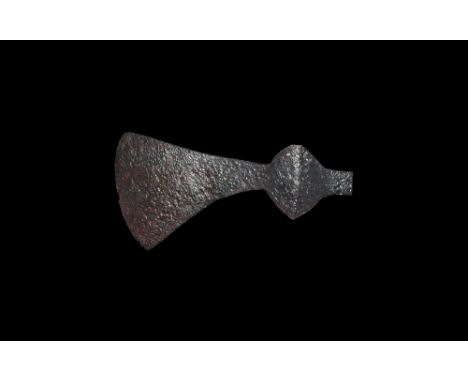 9th-11th century AD. A hand-forged iron axehead with triangular-section blade extending to a curved edge, socket with lateral