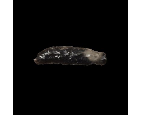 Neolithic, 5th-2nd millennium BC. A knapped bifacial sickle knife in a grey-brown translucent flint, showing some wear polish