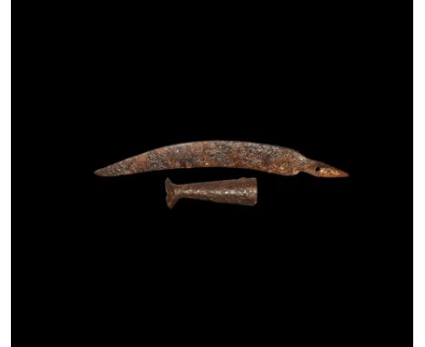 2nd-1st century BC. A hand-forged iron sica single-edged knife with thick, angled and fullered back, curved blade tang pierce