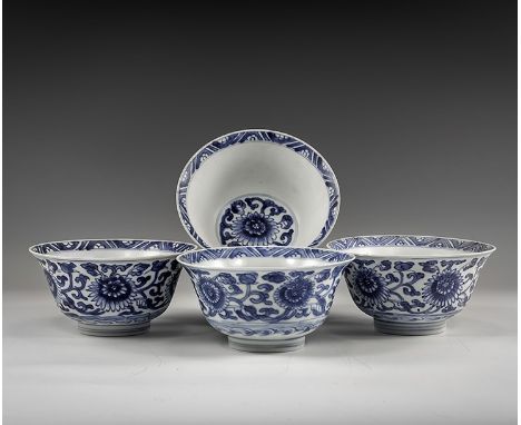 Kangxi Period, Late 17th century AD. A group of four blue and white glazed ceramic bowls with chrysanthemum decoration. From 