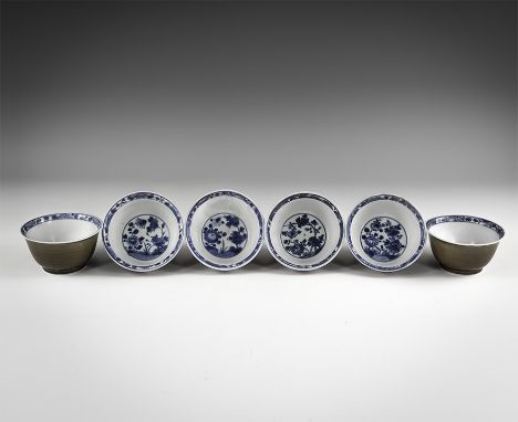 Kangxi Period, Late 17th century AD. A group of six ceramic squat bowls, each with olive glazed exterior, white glazed interi