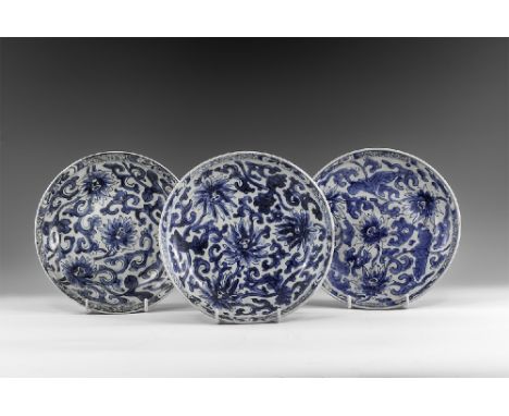 Kangxi Period, Late 17th century AD. A group of three blue and white glazed ceramic dishes with chrysanthemum decoration. Fro