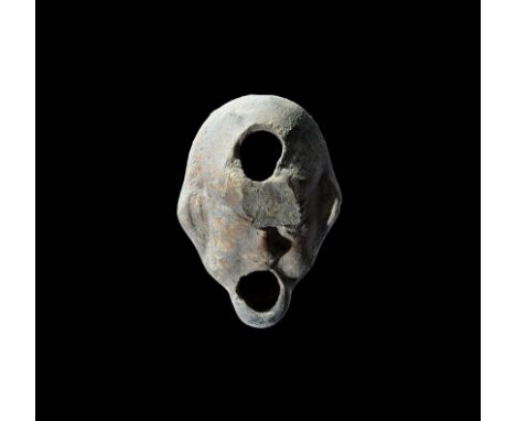 3rd century AD. A terracotta oil lamp formed as a human head with the open mouth as the nozzle, filler hole to the brow, tree