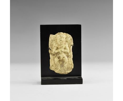 20th-16th century BC. A terracotta plaque with moulded image of Humbaba (or Huwawa), the lion faced demon, standing with his 