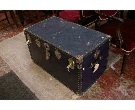Two vintage travelling trunks, together with some household linen, a pair of gilt picture frames, books to include The Univer