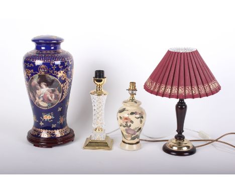 An ornate porcelain lamp base and three other table lamps. (sold as parts)