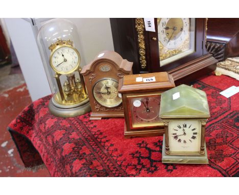 Four mantel clocks, a green onyx example with brass column supports, white enamel face with roman numeral markers by Dupree &