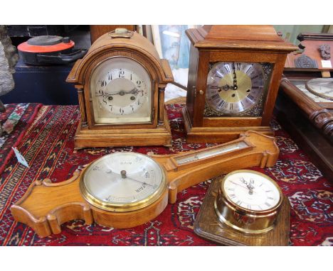 Two mantel clocks, a brass ships clock on a mahogany board and a light oak barometer