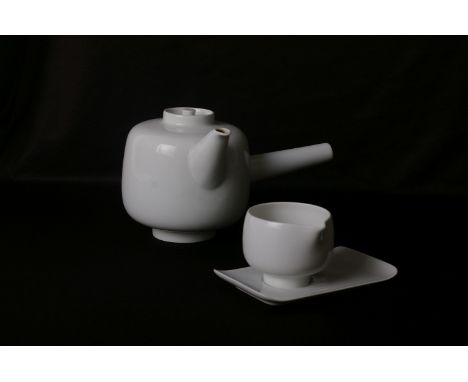 Bodo Kampmann for Furstengerg, a Form A white glazed porcelain teapot, designed in 1957, with a matching cream jug and a sauc